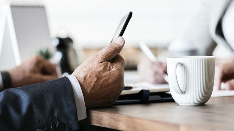 A lawyer holding his cellphone