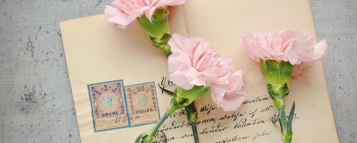 A letter and pink flowers
