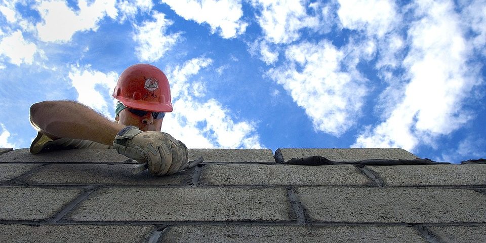 A contractor putting tiles