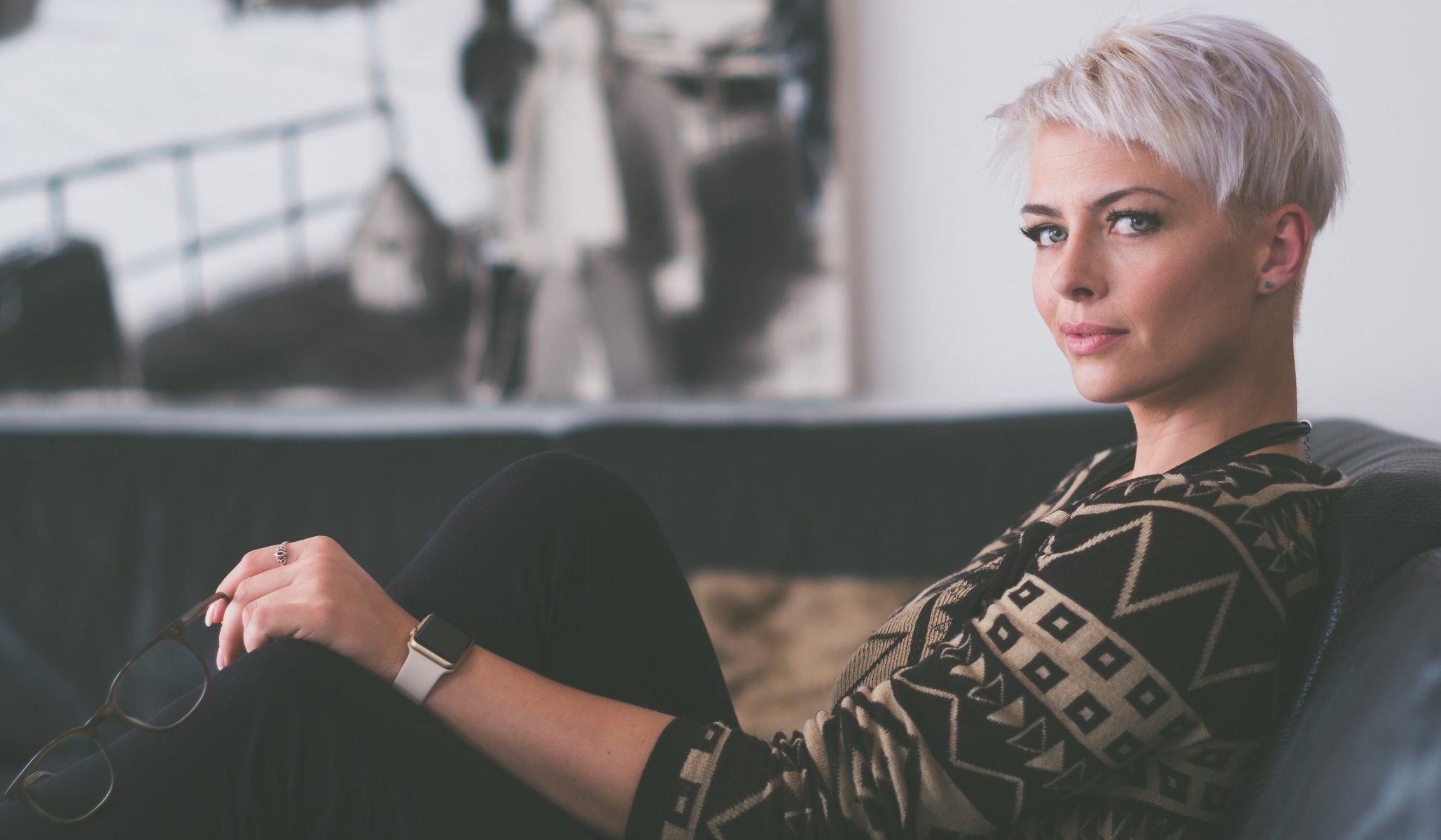 A beautiful woman sitting on a sofa