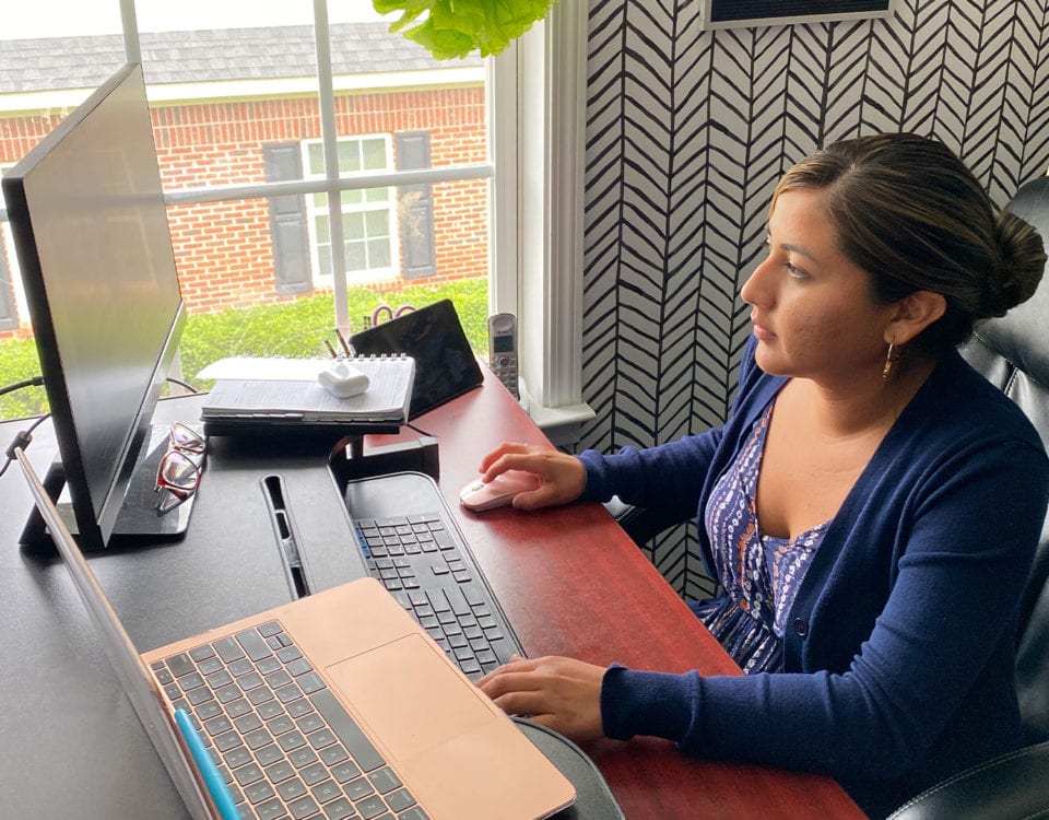 A woman working by the computer