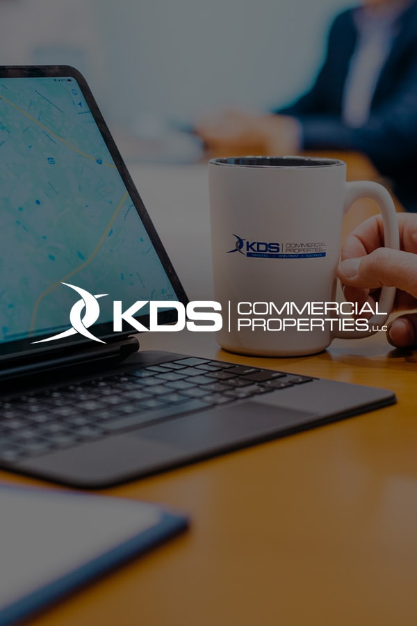 KDS properties logo on an office background