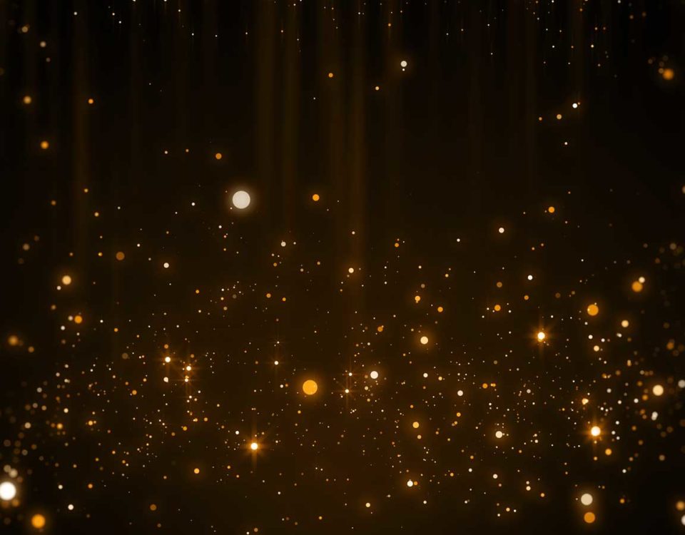 gold sparkles on a dark background