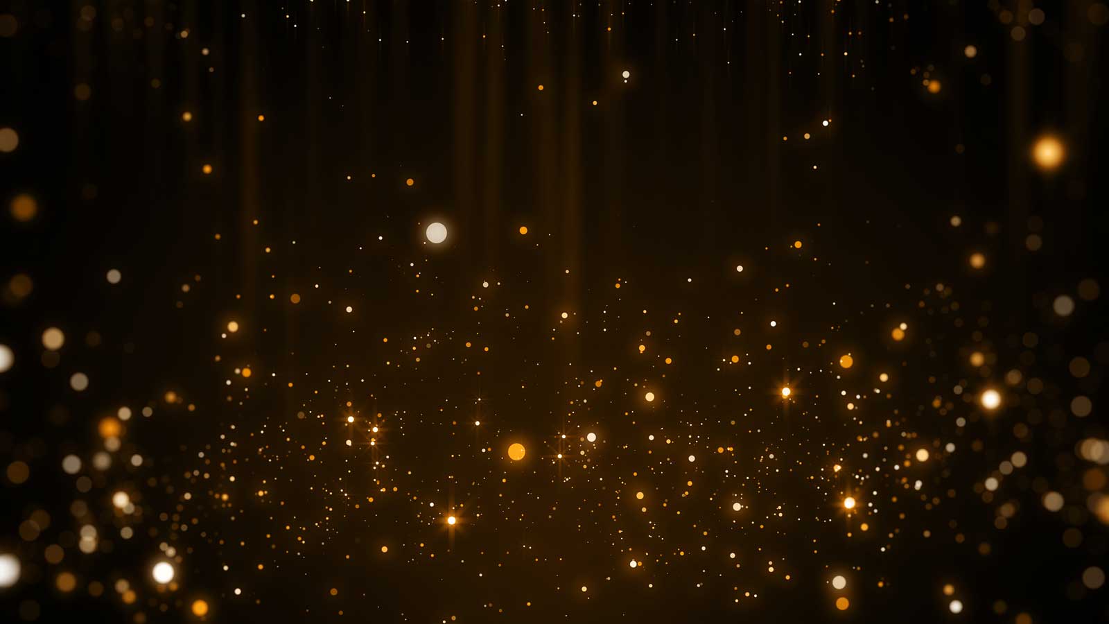 gold sparkles on a dark background
